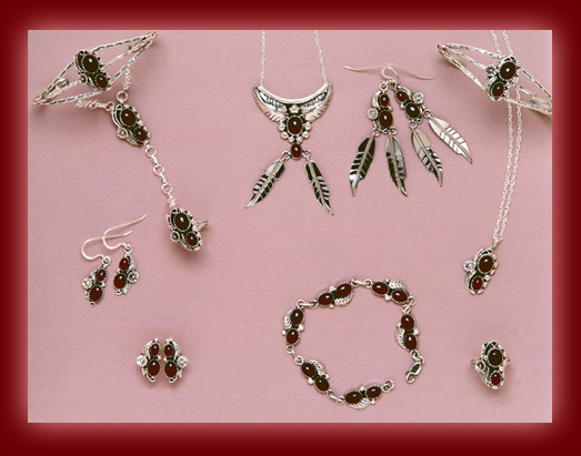 Bracelets, earrings, rings, bolas, pendants, and necklaces made from Red Garnet and Sterling Silver settings.