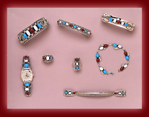 Turquoise, Red Coral, and Mother of Pearl gemstones mounted in a unique combination of Navajo Indian Jewelry.