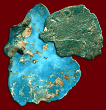 The stone, which ranges from light blue to gray-green, is usually interspersed with brown, dark gray, or black veins of other minerals or the host rock.